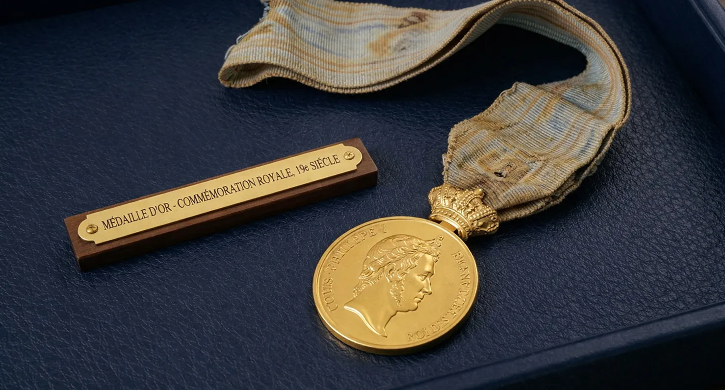 histoire medaille or